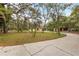 Charming home with mature landscaping, a circular drive, and a detached two-car garage at 4495 Bedford Rd, Sanford, FL 32773