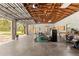 Spacious garage interior with high ceilings, work benches, and open door to the backyard at 4495 Bedford Rd, Sanford, FL 32773
