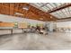 Spacious garage with high ceilings, storage cabinets, work benches, and ample room for projects and parking at 4495 Bedford Rd, Sanford, FL 32773