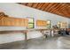 Garage featuring storage, work benches along the wall, cabinets, and ample room for projects at 4495 Bedford Rd, Sanford, FL 32773