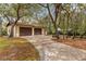 Detached two car garage with a long driveway, picnic area, and mature trees at 4495 Bedford Rd, Sanford, FL 32773