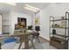 Cozy home office featuring a desk, modern decor, shelving, and a window for natural light at 4495 Bedford Rd, Sanford, FL 32773