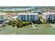 Aerial view of waterfront condos with docks and stunning water views and greenery at 5 Riverwalk Dr # 604, New Smyrna Beach, FL 32169