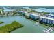 Waterfront condo community featuring private boat docks, lush landscaping, and stunning water views at 5 Riverwalk Dr # 604, New Smyrna Beach, FL 32169