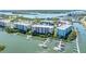 Waterfront condo community featuring private boat docks, lush landscaping, and stunning water views at 5 Riverwalk Dr # 604, New Smyrna Beach, FL 32169
