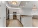 Bright, modern kitchen featuring stainless steel appliances, custom cabinets, and quartz countertops at 5 Riverwalk Dr # 604, New Smyrna Beach, FL 32169