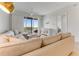 Relax in this bright living room with neutral decor, balcony access, and picturesque water views at 5 Riverwalk Dr # 604, New Smyrna Beach, FL 32169