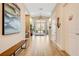 Inviting lobby featuring wood-look tile floors, chandelier, coastal decor, and double door entryway at 5 Riverwalk Dr # 604, New Smyrna Beach, FL 32169