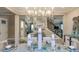 Formal dining room with modern chandelier, stairway and Herringbone tile floors at 5253 Quillback Ln, St Cloud, FL 34771
