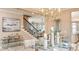 Bright dining room with modern decor, dining table with seating, and view to the stairway at 5253 Quillback Ln, St Cloud, FL 34771