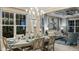Open dining area leads to a living room, features a modern chandelier, and seating for six at 5253 Quillback Ln, St Cloud, FL 34771
