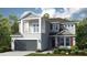Charming two-story home featuring a front porch, balcony, and a two-car garage at 5253 Quillback Ln, St Cloud, FL 34771