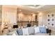 Cozy loft area with comfortable seating, modern decor, a desk for work, and a view of the downstairs at 5253 Quillback Ln, St Cloud, FL 34771