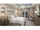 Elegant main bedroom with soft lighting, neutral tones, and a decorative chandelier at 5253 Quillback Ln, St Cloud, FL 34771