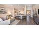 Open-concept living room and kitchen area with a large island, recessed lighting, and hardwood floors at 5271 Quillback Ln, St Cloud, FL 34771