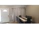 Neutral dining area with a bright white dining table, seating for six and tile flooring at 614 Gaul Way, Kissimmee, FL 34759