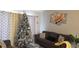 Cozy living room with modern decor, neutral walls and a comfortable gray sofa at 614 Gaul Way, Kissimmee, FL 34759