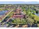 An aerial view shows the community's layout with a pond, trees, and roadways nearby at 6218 Forsythe Loop, Sanford, FL 32771