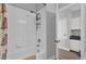 Bathtub with shower and white tile surround at 6218 Forsythe Loop, Sanford, FL 32771