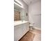 Neat bathroom features a white vanity, a toilet, and a shower with a patterned curtain at 6218 Forsythe Loop, Sanford, FL 32771