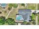 Overhead view of the fenced-in backyard, screened-in pool, patio area, and roof at 731 Rosemere Cir, Orlando, FL 32835