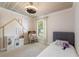 Charming bedroom featuring a cozy bed and unique decor, including a dollhouse and play kitchen at 731 Rosemere Cir, Orlando, FL 32835