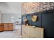 Stylish entryway features a brick accent wall, coat rack, and shoe storage at 731 Rosemere Cir, Orlando, FL 32835