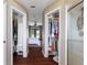 Hallway leading to the main bedroom and bathroom with closet space for storage at 731 Rosemere Cir, Orlando, FL 32835