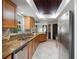 Modern kitchen with stainless steel appliances, granite countertops, and tile flooring at 731 Rosemere Cir, Orlando, FL 32835