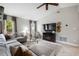 Bright living room with tile flooring, vaulted ceilings, fan, fireplace, and plenty of natural light at 731 Rosemere Cir, Orlando, FL 32835
