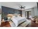 Comfortable main bedroom with an upholstered headboard, ceiling fan, and private outdoor access at 731 Rosemere Cir, Orlando, FL 32835
