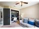 Inviting home office with a built-in desk, comfortable seating, and a ceiling fan at 731 Rosemere Cir, Orlando, FL 32835