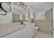 Well-lit bathroom featuring a vanity with ample counter space, a shower, and a toilet at 7420 Lake Willis Dr, Orlando, FL 32821