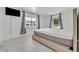Bright bedroom with large windows, modern bed, and views of the lake at 7420 Lake Willis Dr, Orlando, FL 32821