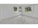 Bright bedroom with large windows and marble floors at 7420 Lake Willis Dr, Orlando, FL 32821