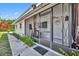 Covered porch with view of the home's front door at 7420 Lake Willis Dr, Orlando, FL 32821