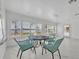 Bright sunroom with lake views featuring modern décor and sleek flooring at 7420 Lake Willis Dr, Orlando, FL 32821