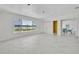 Bright open floor plan with sleek flooring and lake views at 7420 Lake Willis Dr, Orlando, FL 32821