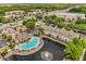 Aerial view showcasing a community pool and surrounding apartment buildings at 10154 Regent Square Dr # 201, Orlando, FL 32825
