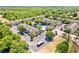 Aerial view of well-maintained condos with a central pond, fountain, and pool area at 10154 Regent Square Dr # 201, Orlando, FL 32825