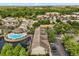 Overhead view of apartment complex, community pool, and surrounding parking areas at 10154 Regent Square Dr # 201, Orlando, FL 32825