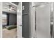 Bathroom includes shower with frosted glass doors and a bedroom view at 10154 Regent Square Dr # 201, Orlando, FL 32825