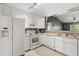 Bright kitchen with white appliances and tile flooring at 10154 Regent Square Dr # 201, Orlando, FL 32825