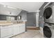 Efficient kitchen with laundry appliances, next to breakfast bar at 10154 Regent Square Dr # 201, Orlando, FL 32825