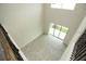 Bright, open living room with tiled floor, high ceiling, and sliding glass doors to backyard at 1030 Teal Creek Dr, St Cloud, FL 34771