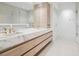 Elegant bathroom with dual sinks, modern cabinetry, and a glass-enclosed shower at 10339 Kensington Shore Dr # J-202, Orlando, FL 32827