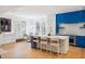 Bright, modern kitchen featuring a large island with seating and sleek blue and white cabinetry at 10339 Kensington Shore Dr # J-202, Orlando, FL 32827