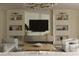 Elegant living room with built-in shelving, modern lighting, and neutral decor creating a serene and inviting atmosphere at 10339 Kensington Shore Dr # J-202, Orlando, FL 32827