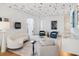 Spacious and stylish living room with unique ceiling design, offering a modern and comfortable atmosphere at 10339 Kensington Shore Dr # J-202, Orlando, FL 32827
