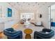 Open concept living area with modern furnishings, showcasing unique design elements and ample space at 10339 Kensington Shore Dr # J-202, Orlando, FL 32827